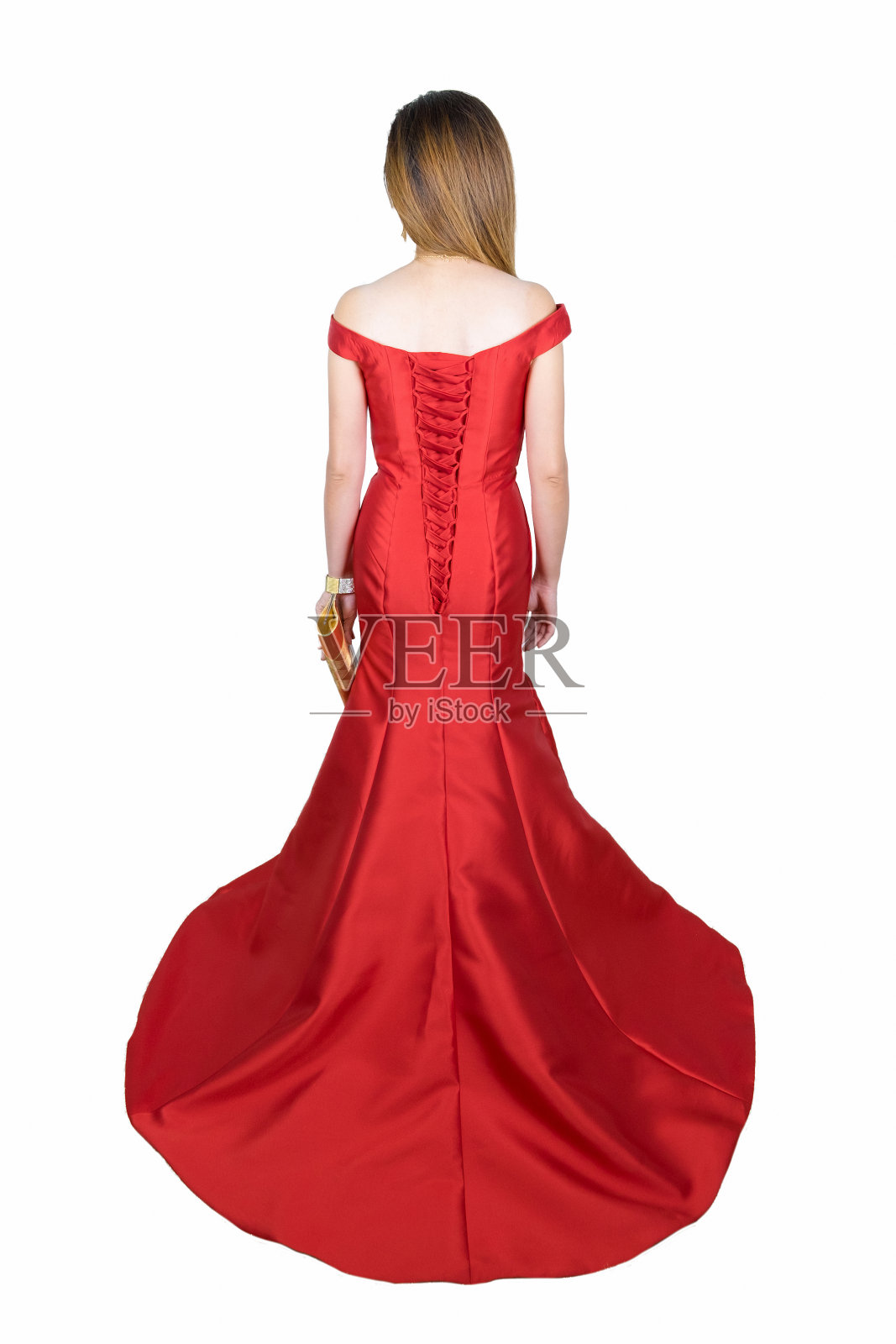 后视图红色优雅的女人长豪华礼服。全长肖像孤立在白色的背景。照片摄影图片
