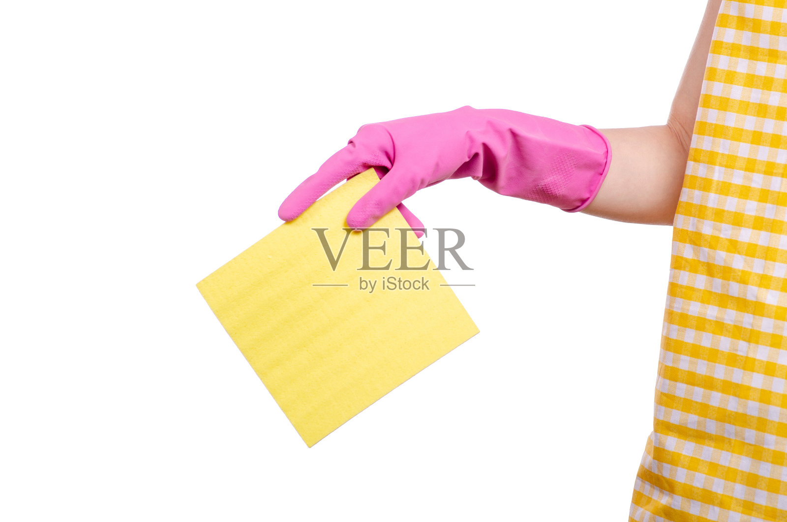 女人穿着围裙，手里拿着抹布在清洁手套照片摄影图片