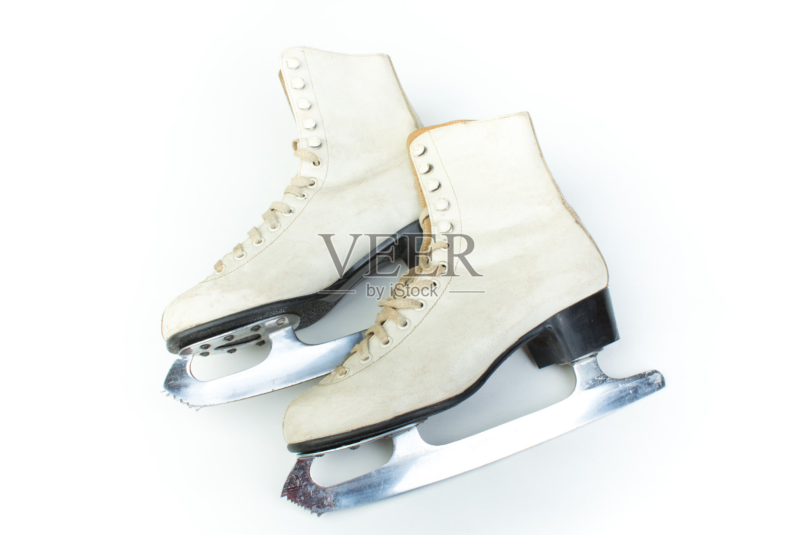 一对旧的Figure Ice溜冰鞋孤立在白色的背景。前视图。照片摄影图片