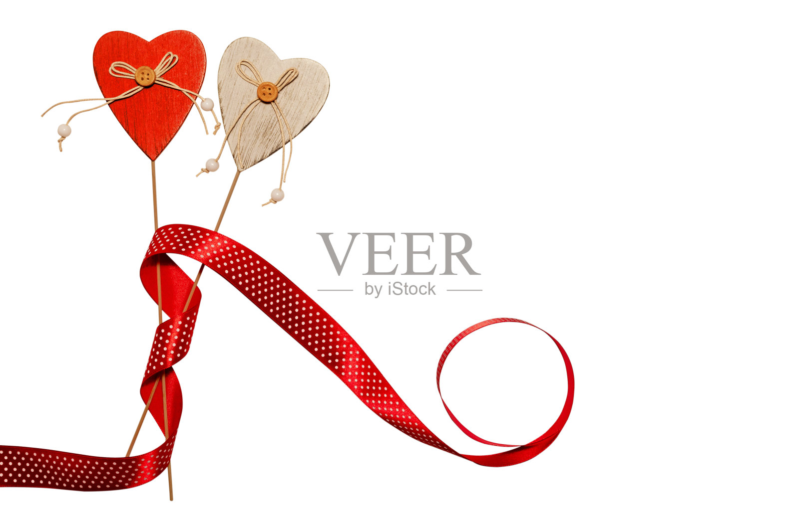 心棍装饰用红丝带孤立。婚礼和情人节的概念。照片摄影图片