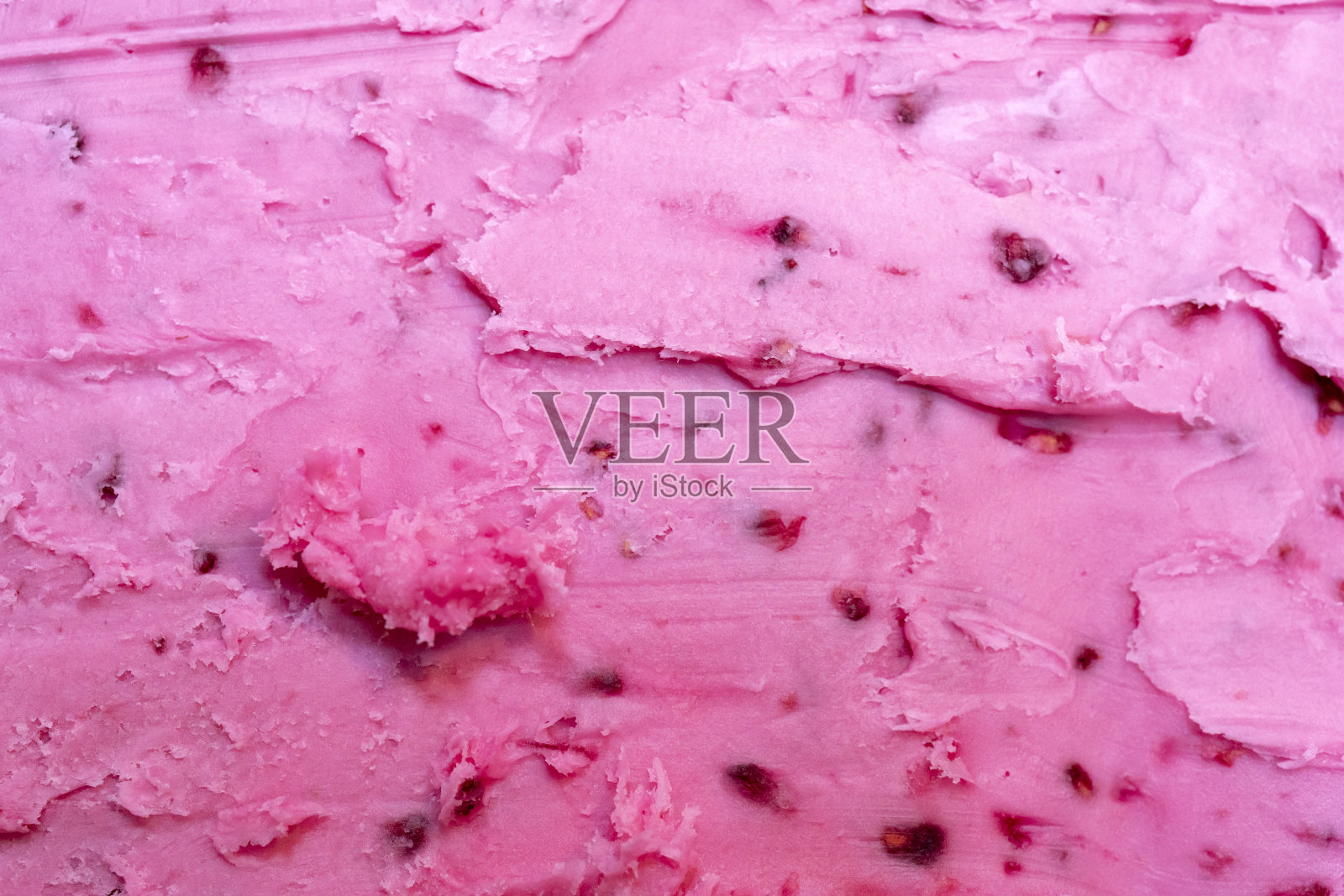 浆果冰淇淋的粉红色质地。照片摄影图片