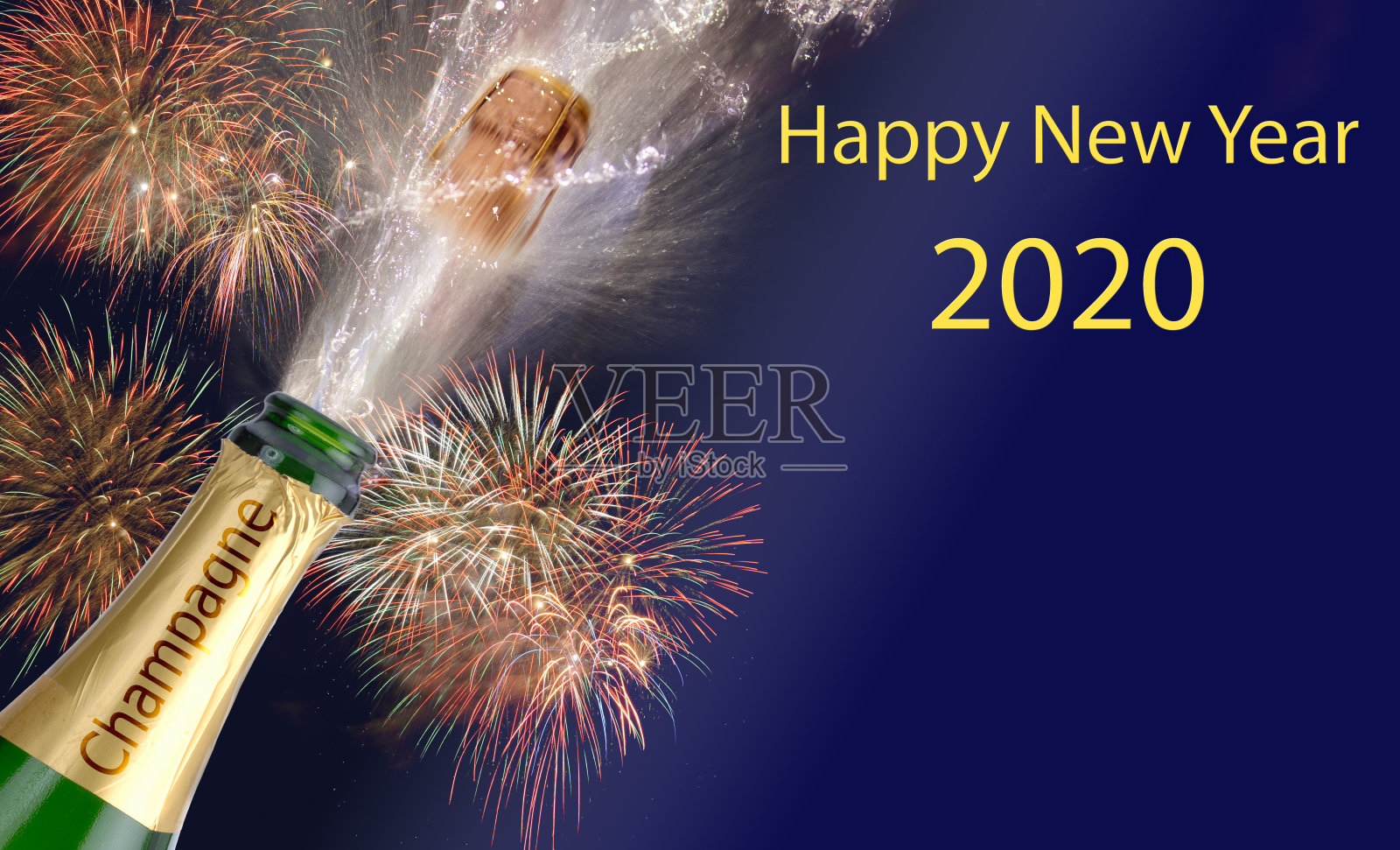 用烟花和泼洒的香槟祝你2020年新年快乐照片摄影图片