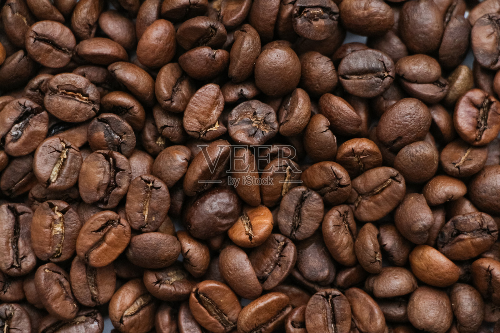 近距离观看棕色烘焙咖啡豆照片摄影图片