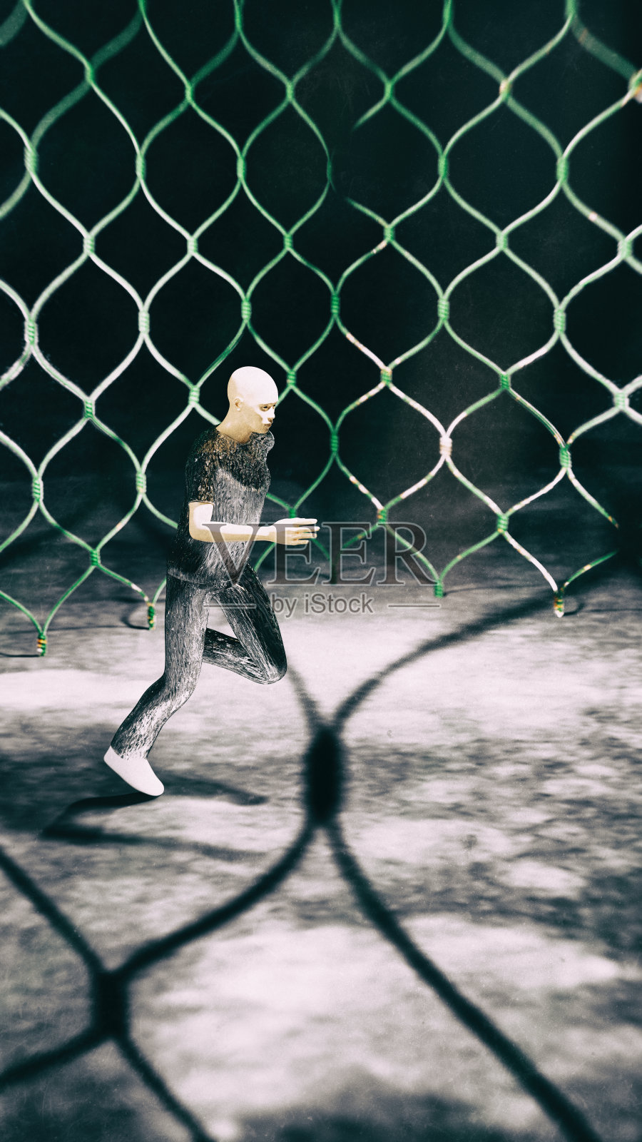 在黑暗的背景下，一个男人在一个封闭的笼子里奔跑照片摄影图片