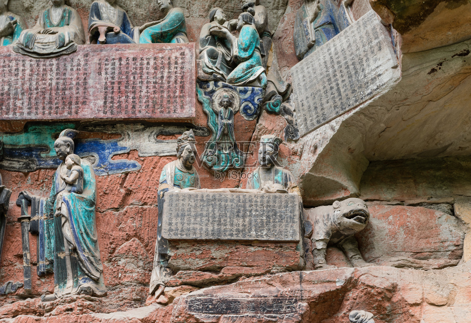 大足石刻描绘佛教故事的雕塑照片摄影图片