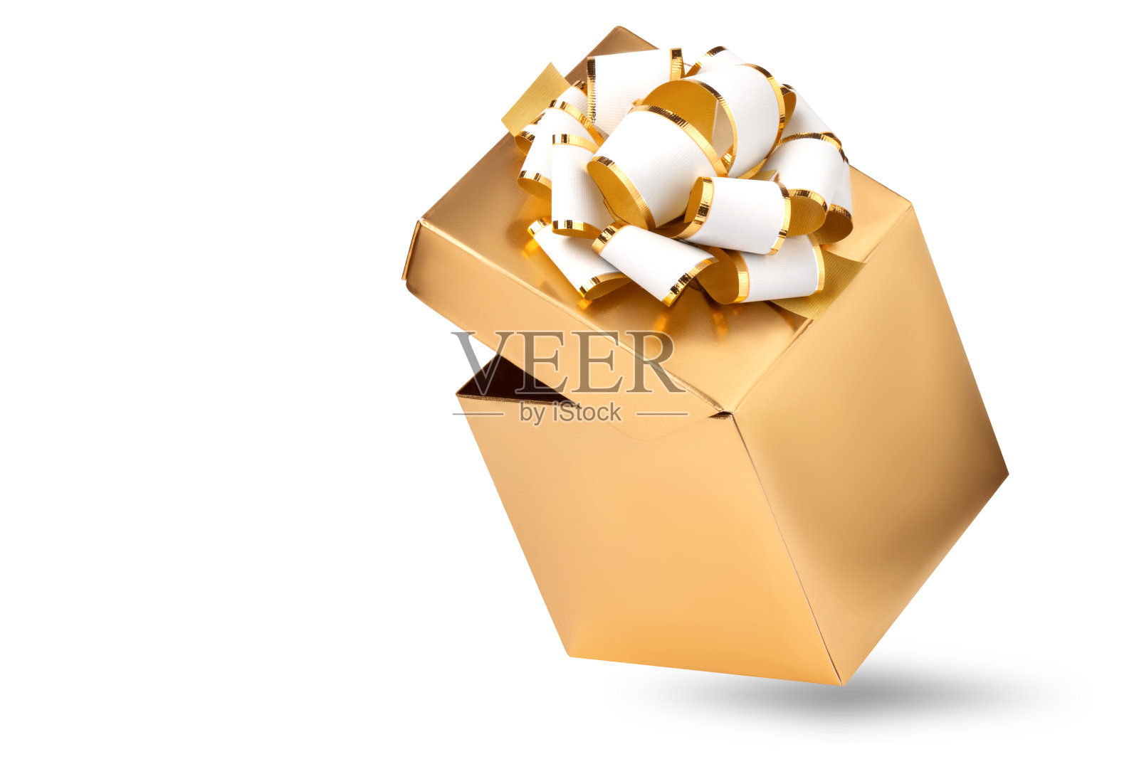金色礼盒与白色装饰弓，孤立在白色背景照片摄影图片