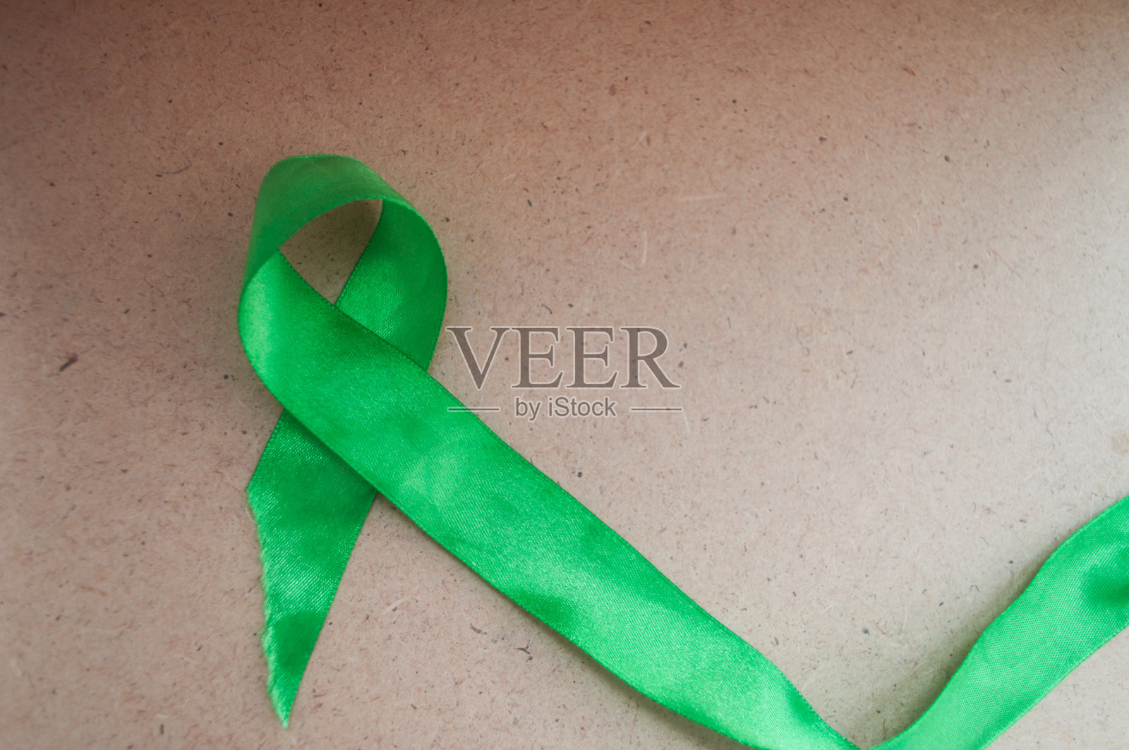 绿色意识丝带，精神健康和淋巴瘤，世界精神卫生日照片摄影图片