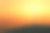 风力涡轮机的剪影在日落的山上素材图片