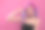 肖像年轻迷人的女人化妆在黑色的顶部和项圈显示螺丝松动的手指手势。工作室。长度的一半。粉红色的背景。副本的空间。素材图片
