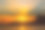 日落在海边的山上素材图片