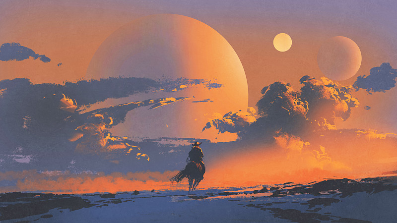 日落时分，牛仔骑着马图片素材